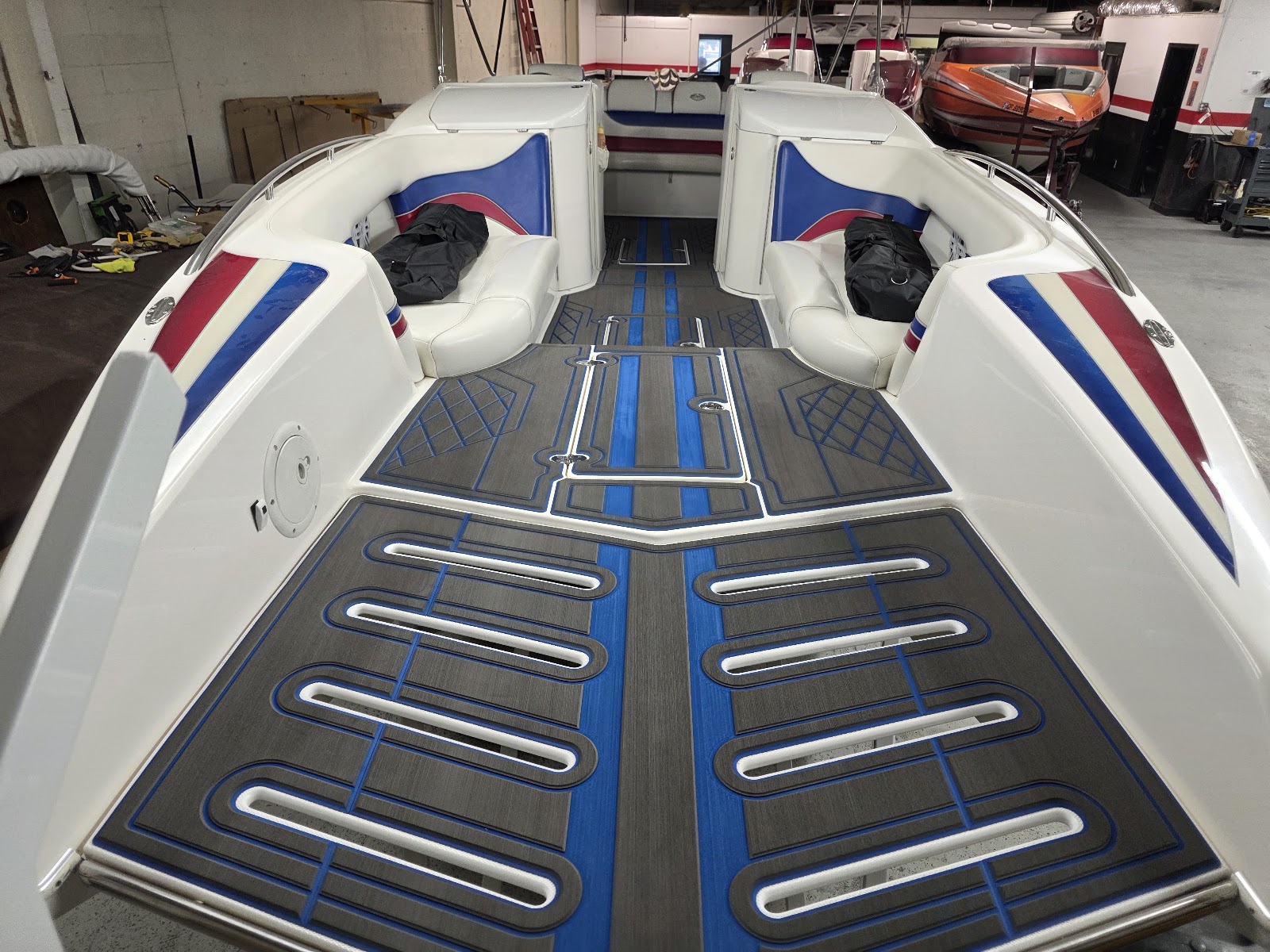 Boat interior finished in gray and blue marine decking