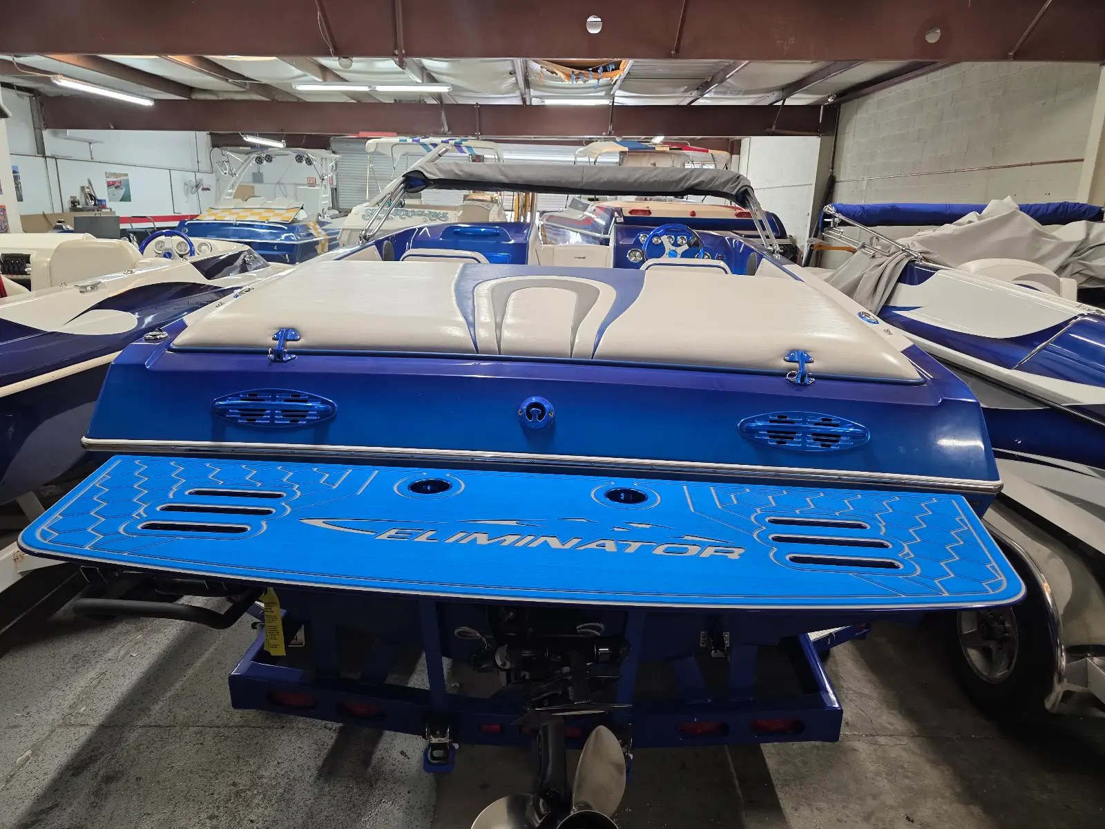 Blue custom swim platform fitted to a boat inside the Swim Platforms LHC shop
