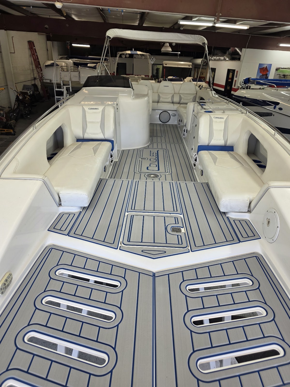 Full boat floor covered in fitted gray marine decking