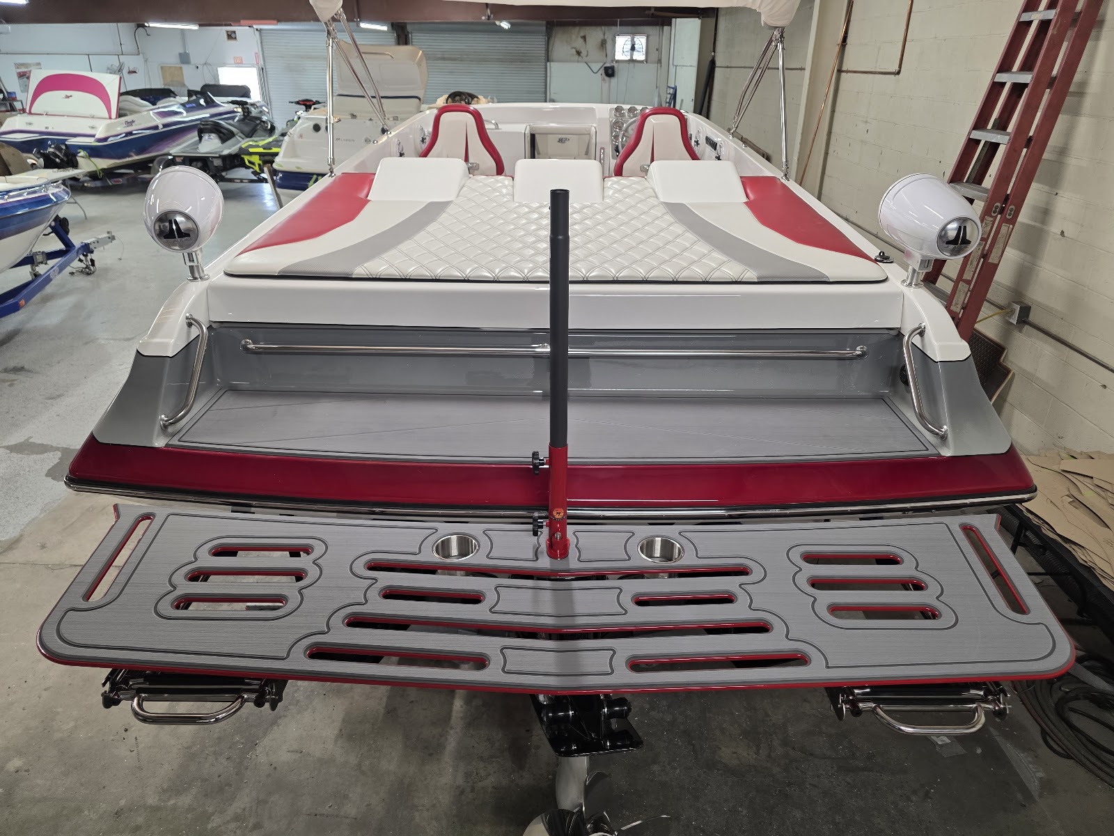Red and white boat stern with a finished swim platform