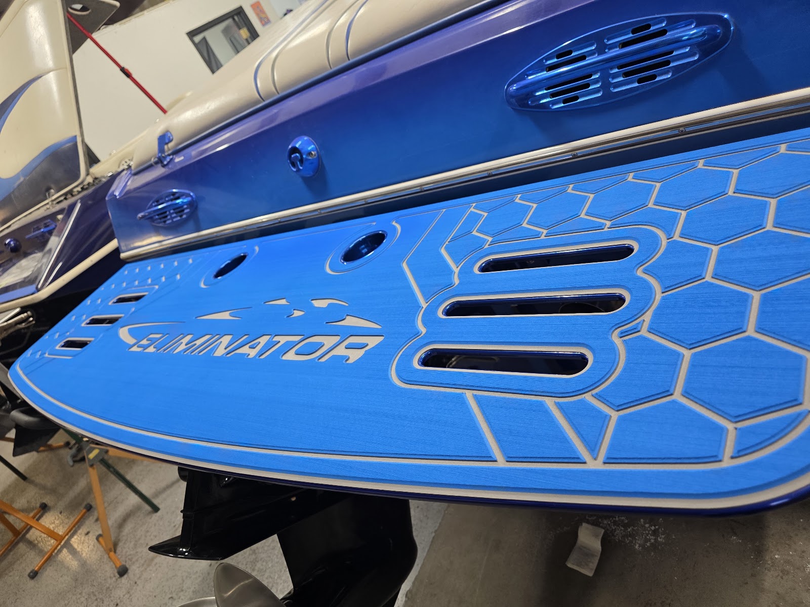 Blue custom-cut marine decking on an Eliminator swim platform
