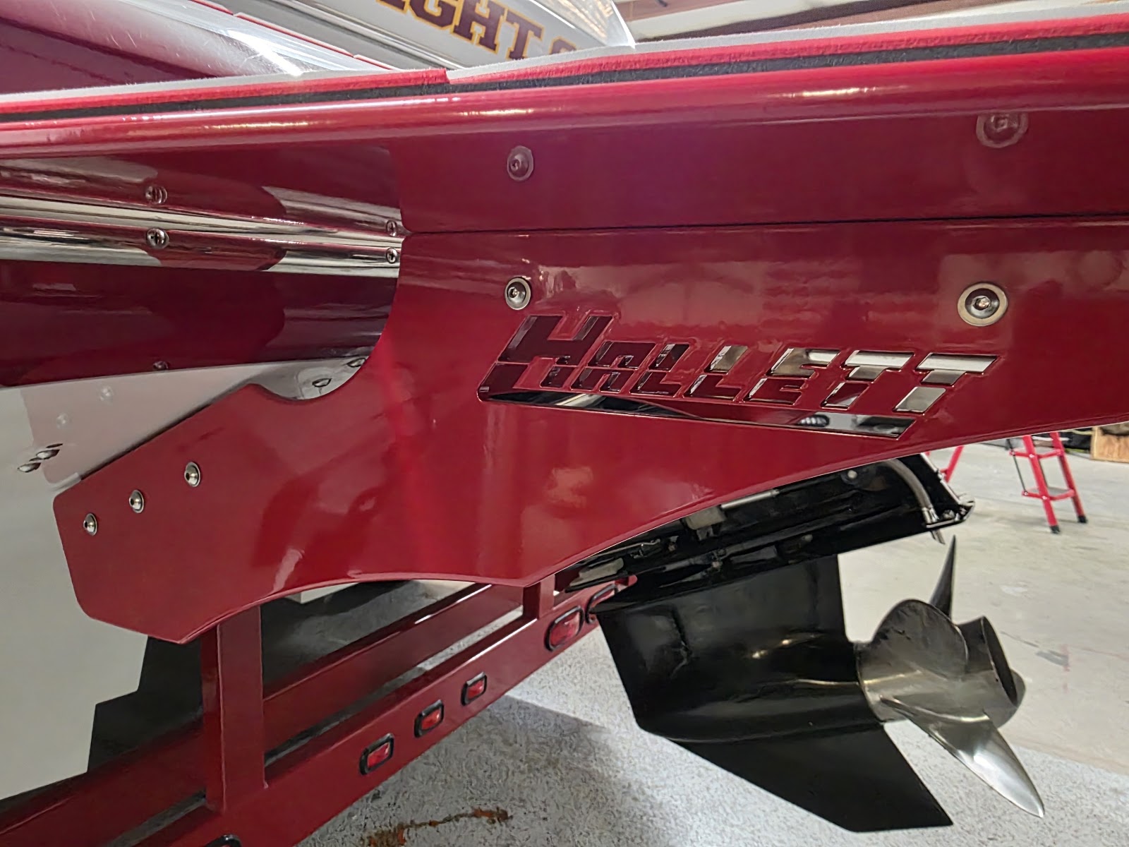 Close-up of red powder-coated swim platform brackets