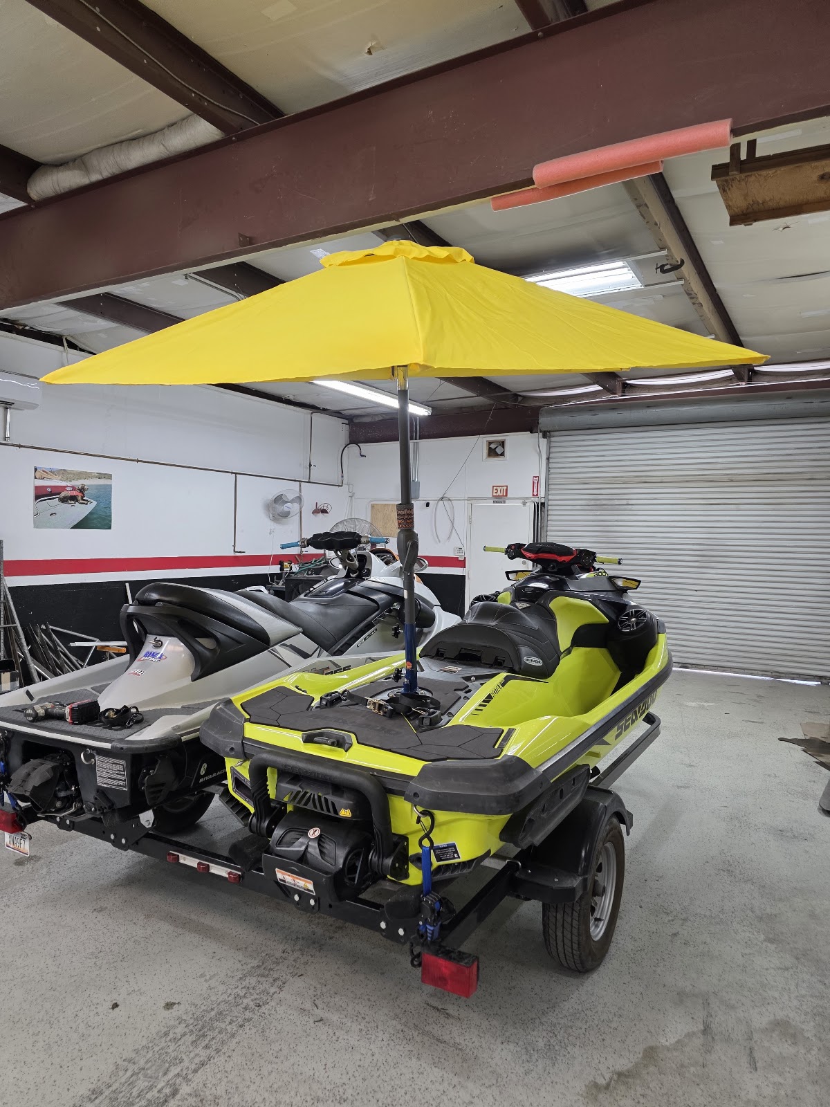 Yellow Sandbar Shade umbrella mounted on a Sea-Doo in the shop