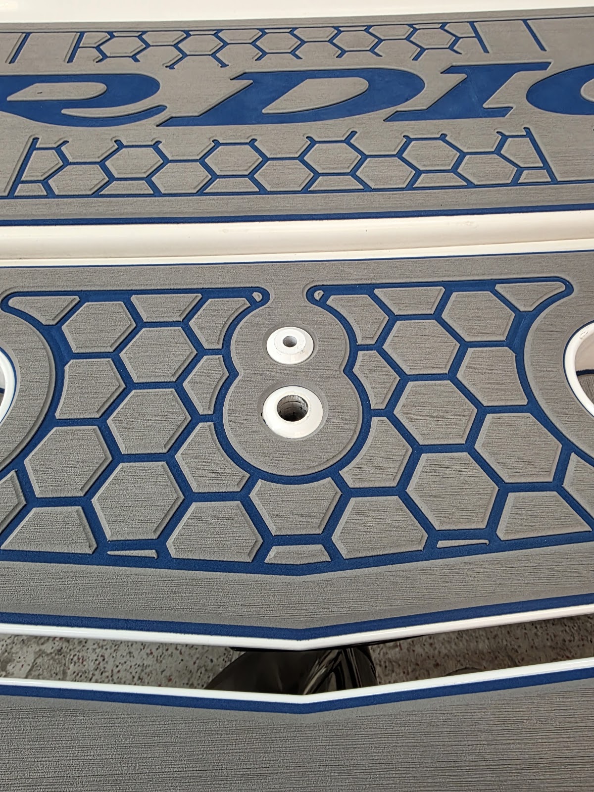 Close-up of blue honeycomb marine decking and hardware